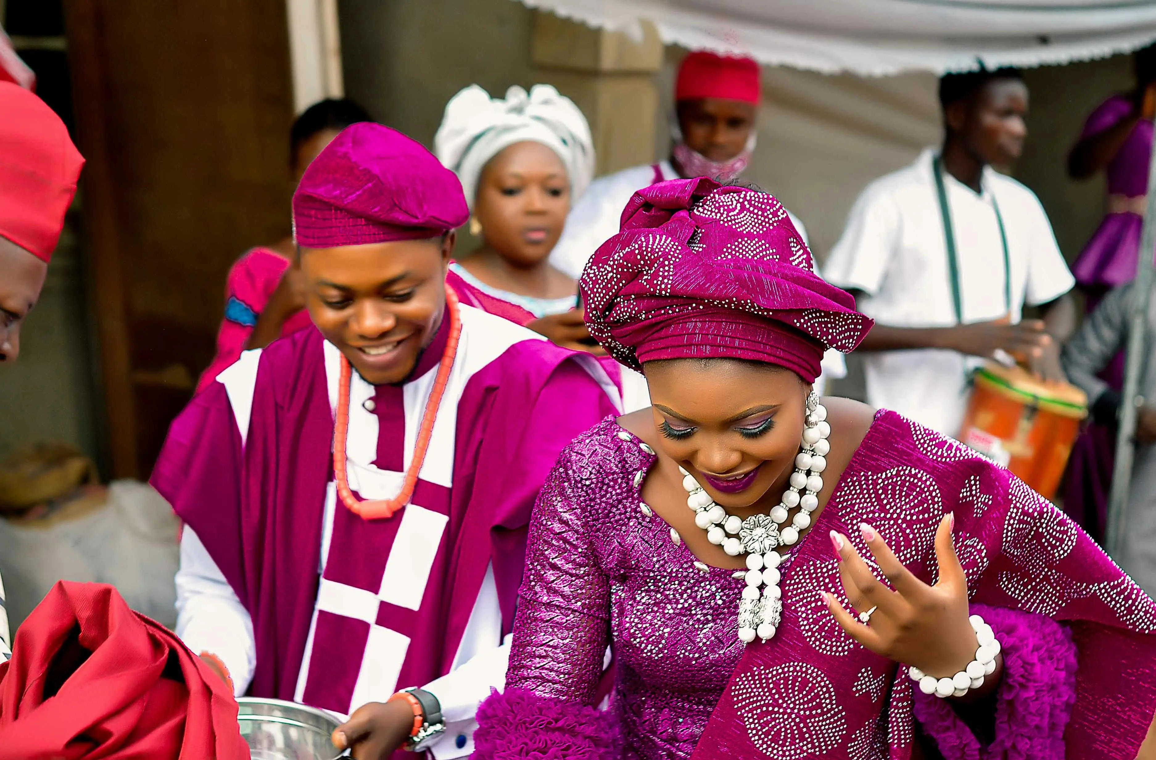 A wedding party in matching magenta lace