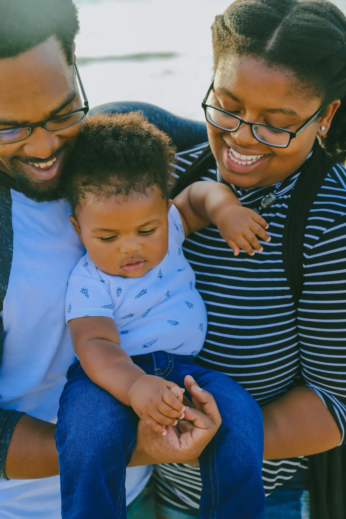Parents laughing with their baby son