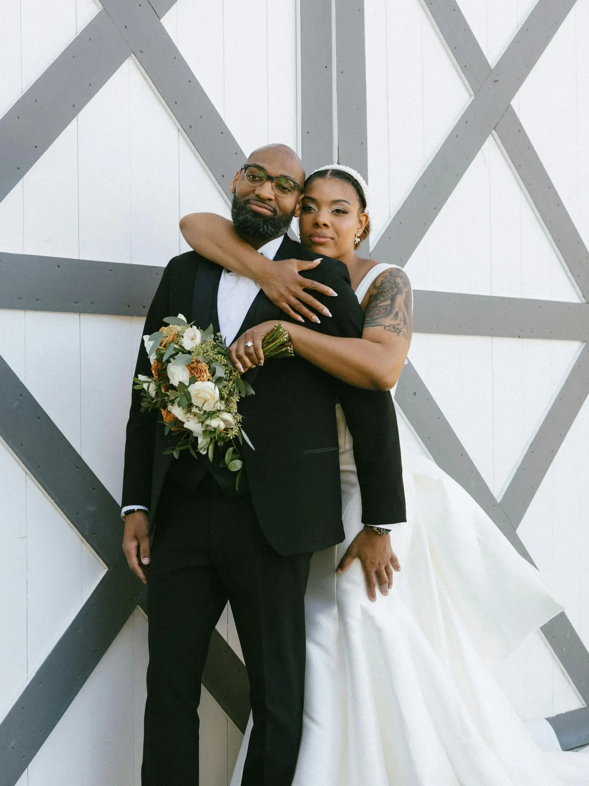 A couple reviewing the gallery from their wedding day