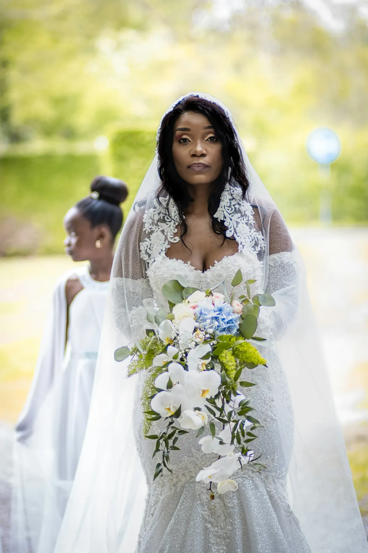 Bride holding her bouquet in the garden